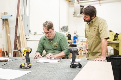 2 men looking at design drawings